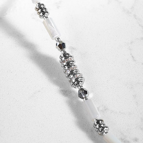Fashionable women’s medical alert bracelet with silver-tone hardware, crystal accents, and luminous Mother of pearl white beads