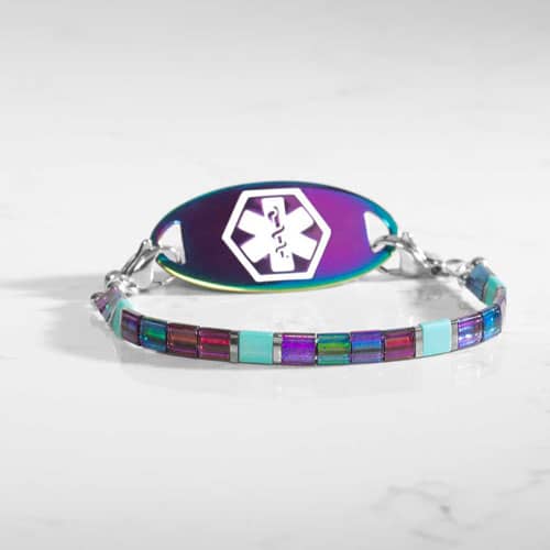 Twilight medical ID bracelet pairing vibrant iridescent tile beads with a colorful alert tag featuring a medical symbol.