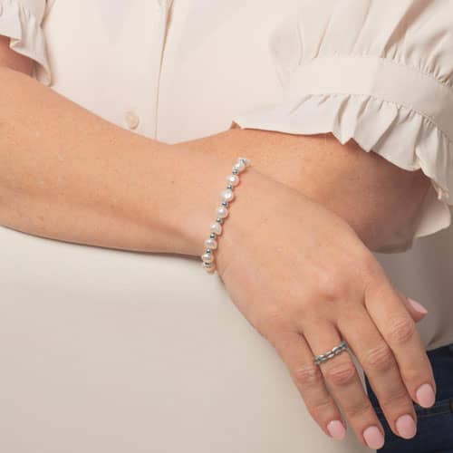 Freshwater pearl medical ID bracelet in Silver styled on wrist for elegant everyday medical alert jewelry.