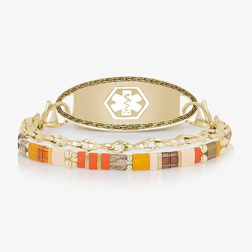 Close-up of the bracelet highlighting colorful rectangular beads in orange, cream, brown, green, and red with gold-tone accents.