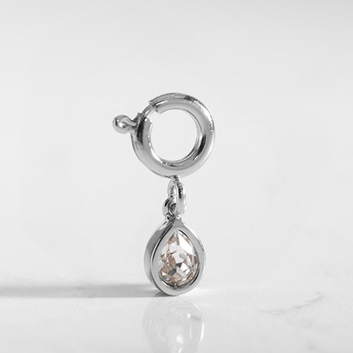 Elegant Kai Crystal Teardrop Charm in silver, featuring a clear cubic zirconia, designed for Lauren’s Hope medical ID jewelry