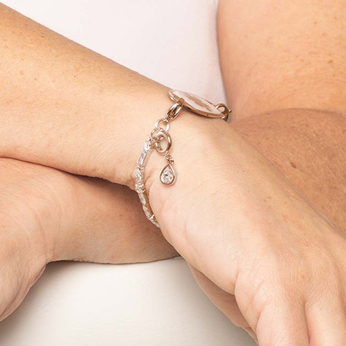 Teardrop-shaped Kai charm in 14k rose gold plated bezel, shown on a Lauren’s Hope medical ID bracelet for women