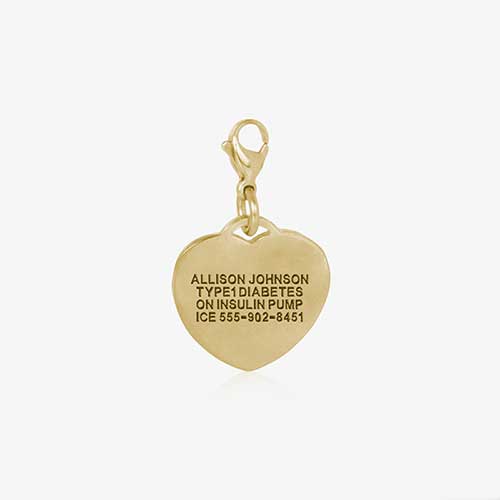 Heart-shaped, gold tone charm, showing premium custom engraving on the back.