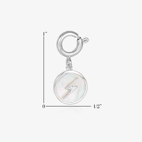 Round, silver charm, featuring a mother of pearl inlay with gold lightning bolt. Showing measurements of one inch by one half inch.
