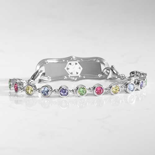 Rhodium and palladium plated women's medical alert bracelet with multi colored, round, bezel set crystals with stainless steel medical ID tag.