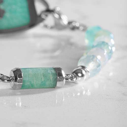 Close up of green beads and barrel centerpiece on silver medical ID bracelet