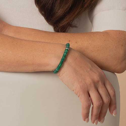 Woman wearing Jade Heishi bracelet