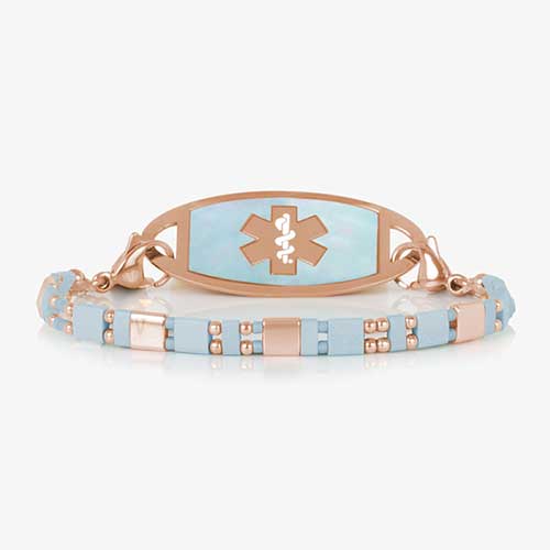 Stylish medical ID bracelet with an aqua and rose mother-of-pearl inlay, featuring an engraved medical alert emblem on a durable metal plate. Elegant and functional design for everyday wear.