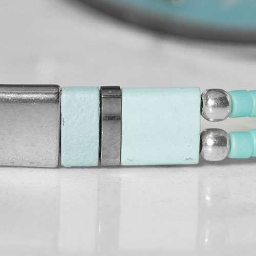 Elegant silver medical ID bracelet laid flat, highlighting mother-of-pearl inlay and secure clasp for everyday wear.