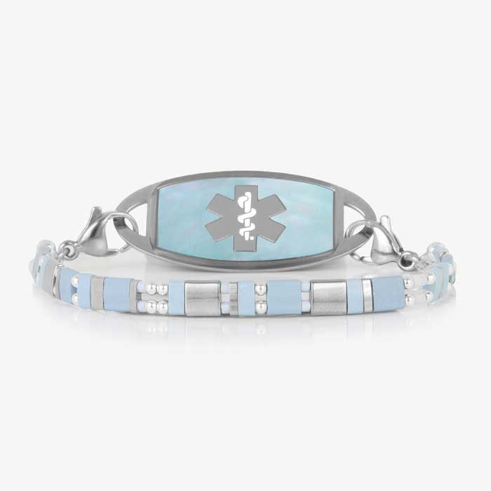 Aqua and silver mother-of-pearl medical ID bracelet with an engraved medical alert symbol, blending style with safety.