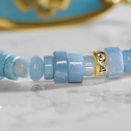 Stylish gold medical ID bracelet laid flat, highlighting intricate craftsmanship, durable chain, and secure clasp.