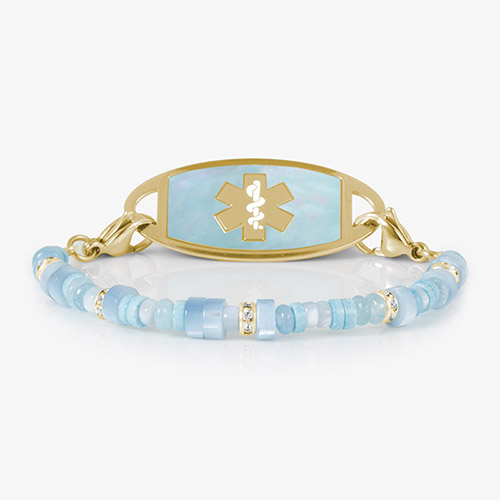 Blue mother-of-pearl and gold medical ID bracelet with a polished metal plate, featuring an engraved medical alert symbol for safety and elegance.