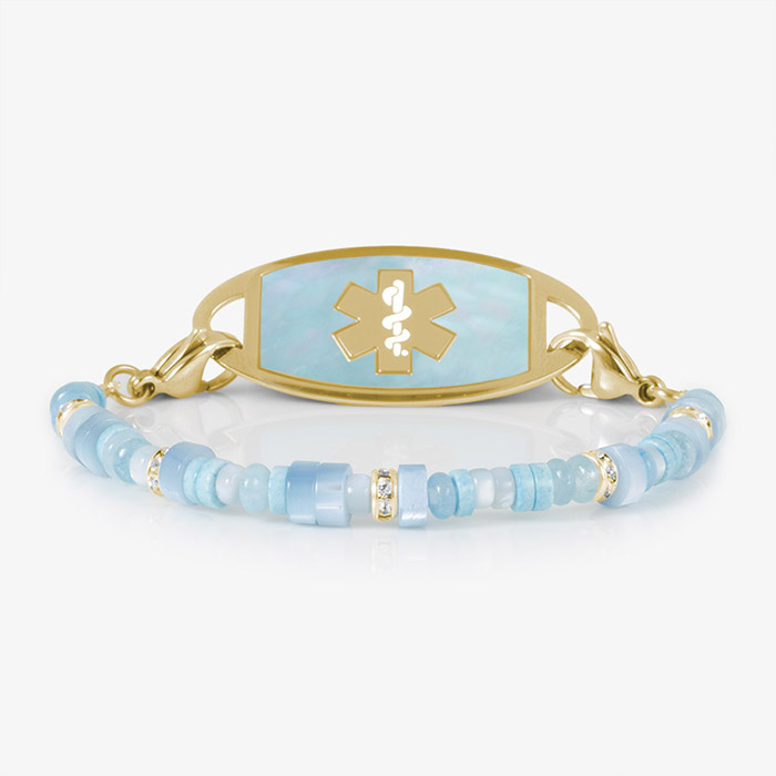 Blue mother-of-pearl and gold medical ID bracelet with a polished metal plate, featuring an engraved medical alert symbol for safety and elegance.