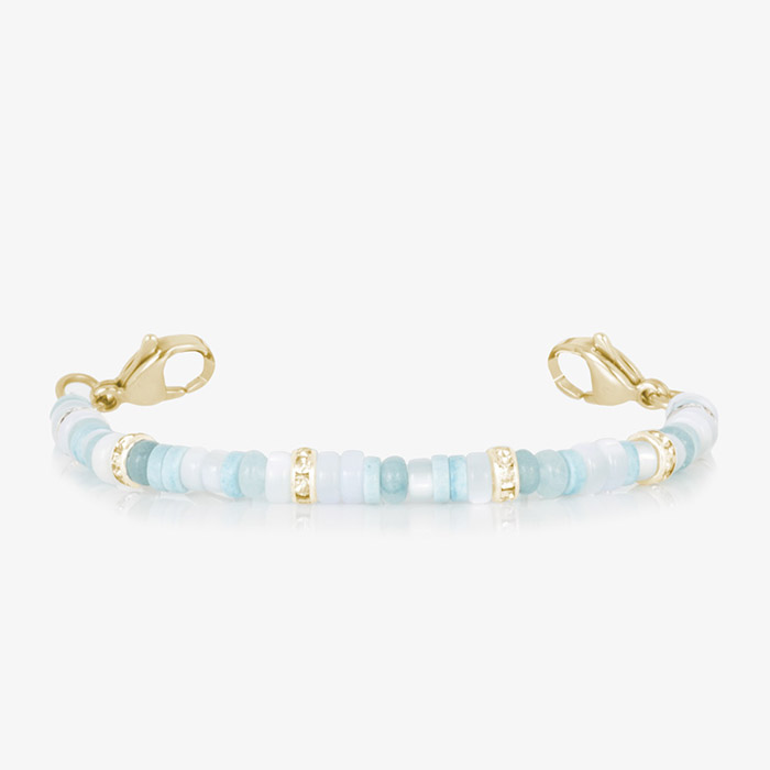 Blue mother-of-pearl and gold medical ID bracelet with a polished metal plate, featuring an engraved medical alert symbol for safety and elegance.