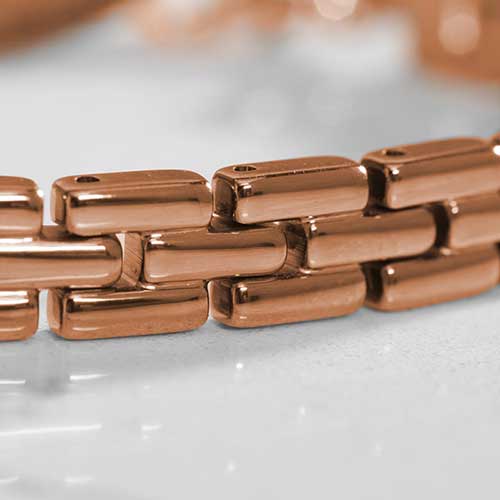 Close up of rose gold tone, stainless steel Gate Link Chain bracelet.