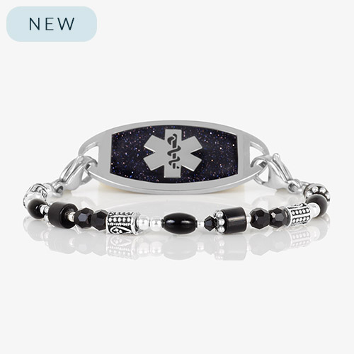 Silver and black medical ID bracelet with a polished tag featuring a glittering deep navy face and silver medical symbol, styled with mixed black, silver, and hematite beads.