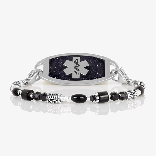 Silver and black medical ID bracelet with a polished tag featuring a glittering deep navy face and silver medical symbol, styled with mixed black, silver, and hematite beads.