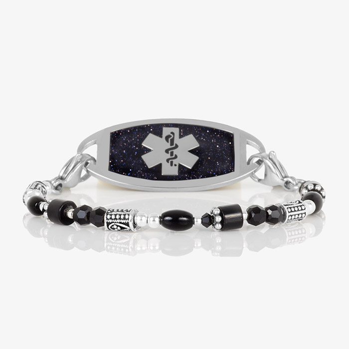Silver and black medical ID bracelet with a polished tag featuring a glittering deep navy face and silver medical symbol, styled with mixed black, silver, and hematite beads.