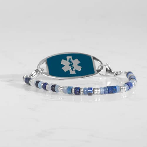 Blue and silver beaded medical ID bracelet on jewelry elastic with stainless steel lobster clasps and sapphire blue decorative med ID tag.