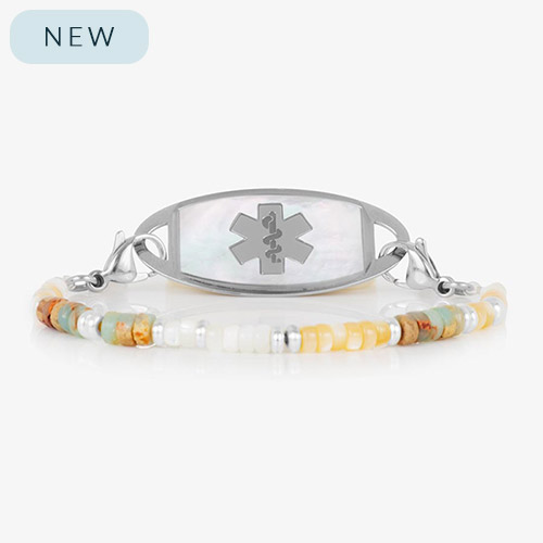 Willow beaded medical ID bracelet with soft-toned gemstone beads and a stainless steel tag featuring a white mother-of-pearl inlay and engraved medical symbol.