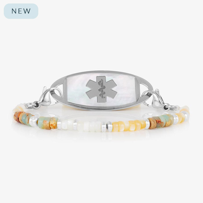 Willow beaded medical ID bracelet with soft-toned gemstone beads and a stainless steel tag featuring a white mother-of-pearl inlay and engraved medical symbol.
