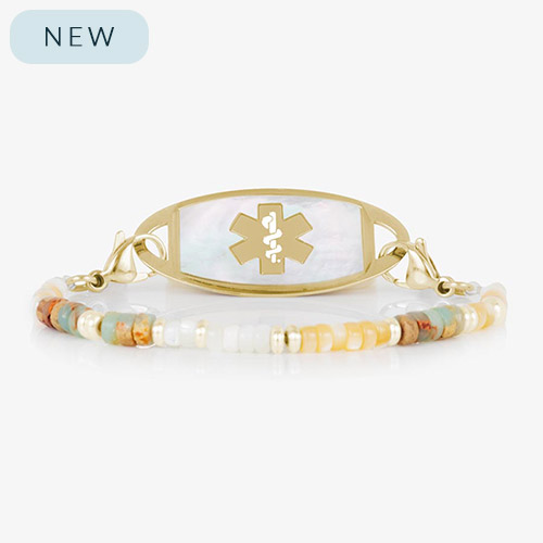 Willow beaded medical alert bracelet with earth-toned gemstone beads and a gold-tone tag with white mother-of-pearl inlay and matching gold medical symbol.
