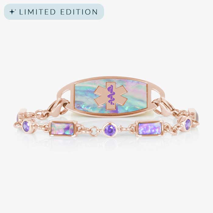 Rose gold medical ID bracelet featuring alternating lilac abalone inlays and violet crystals, paired with matching abalone inlaid ID tag.