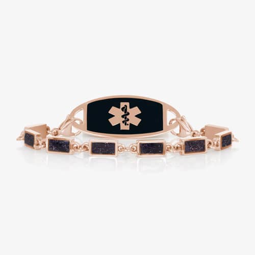 Rose gold-tone medical ID bracelet with a black inlay plaque and rectangular glitter-accent link bracelet.