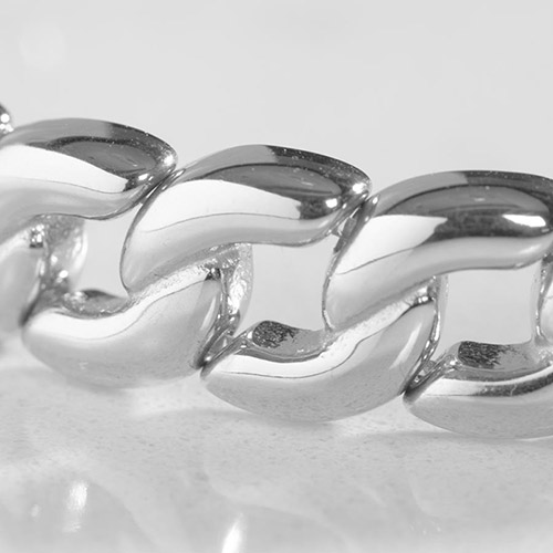 Close-up view of the Frank men's silver medical ID bracelet showing thick, polished curb chain links with high-shine detailing.