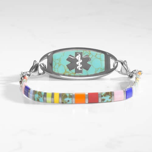 Multicolored stretch medical ID bracelet with orange, blue, and silver accents featuring a Turquoise and Silver ID Tag.