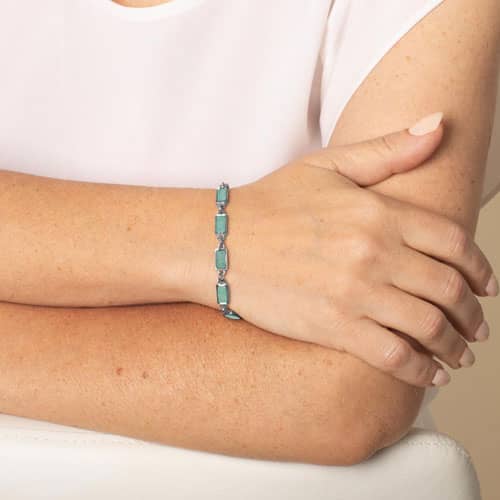 Woman wearing Silver tone linked medical ID bracelet featuring Amazonite stone inlays, attached to a Silver tone medical ID tag with inlaid Amazonite and Silver medical ID symbol.