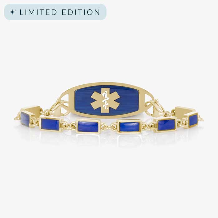 Gold medical ID bracelet with rectangular lapis blue inlays and a matching gold ID tag featuring a blue background and gold medical symbol.
