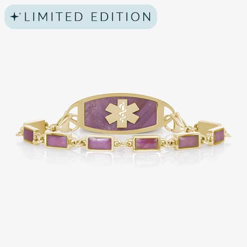Gold medical ID bracelet featuring purple rectangular inlays and a coordinating tag with a marbled purple background engraved with a gold medical caduceus symbol.