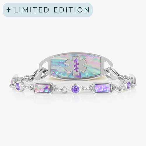 Image shows a silver medical alert bracelet featuring alternating lilac abalone and violet cubic zirconia inlays, paired with a coordinating ID tag engraved with a purple medical symbol.