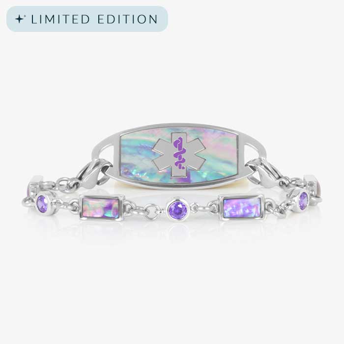 Image shows a silver medical alert bracelet featuring alternating lilac abalone and violet cubic zirconia inlays, paired with a coordinating ID tag engraved with a purple medical symbol.