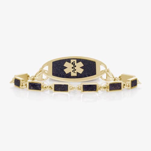Gold-tone medical alert bracelet featuring a midnight blue glitter ID plate with Star of Life emblem and matching glitter link bracelet.