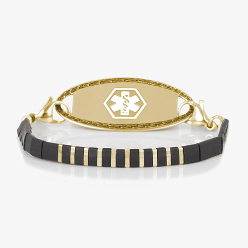 Gold medical ID bracelet with alternating black and gold tila beads and a polished gold ID tag featuring white medical symbol.