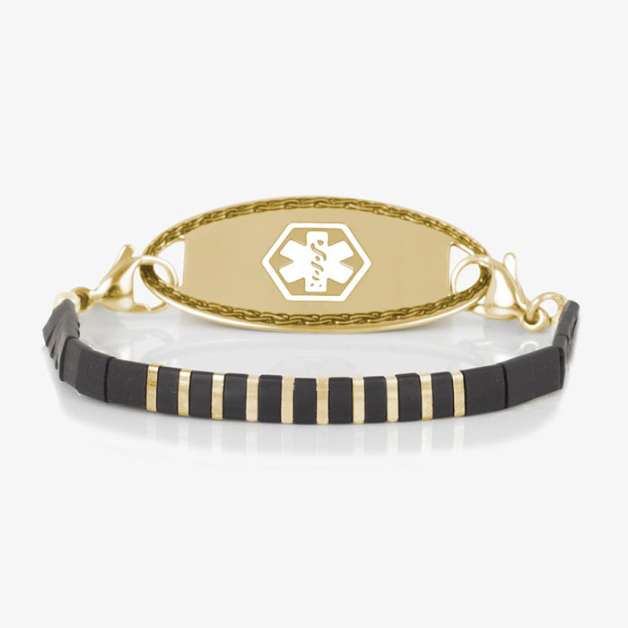 Gold medical ID bracelet with alternating black and gold tila beads and a polished gold ID tag featuring white medical symbol.