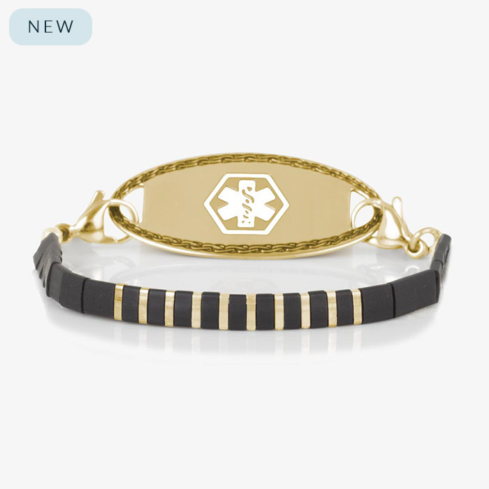 Gold medical ID bracelet with alternating black and gold tila beads and a polished gold ID tag featuring white medical symbol.