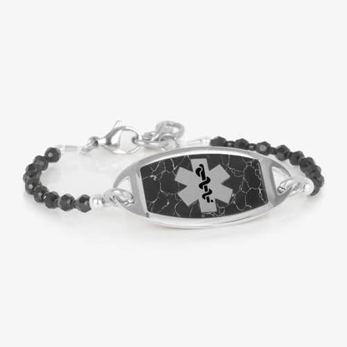 Silver medical ID bracelet with black beaded chain and marble inlay plaque, featuring a Star of Life emblem for safety.