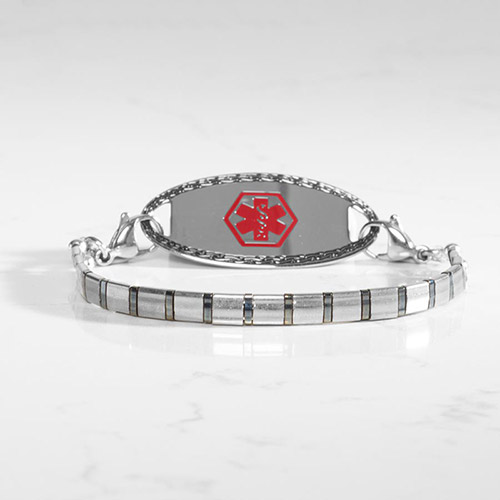 Women's silver medical ID bracelet with mirror-finish tag and red medical symbol, featuring a slim stainless steel stretch band.