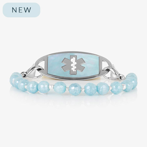Silver medical ID bracelet with aquamarine faceted beads and silver accents, featuring a matching silver ID tag inset with iridescent blue mother-of-pearl and a cutout medical caduceus symbol.