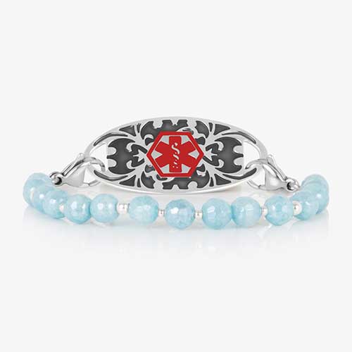 Silver medical ID bracelet with aquamarine faceted beads and silver accents, featuring a decorative silver ID tag with red caduceus.