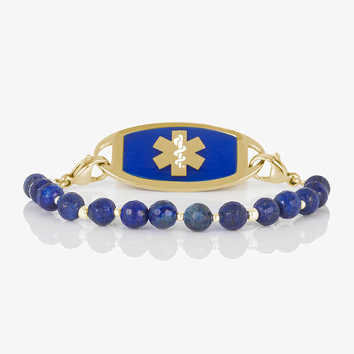 Faceted denim blue lapis beaded medical ID bracelet with gold stainless steel tag engraved with medical alert symbol.