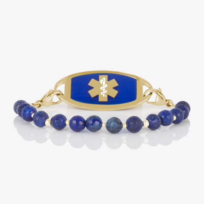 Faceted denim blue lapis beaded medical ID bracelet with gold stainless steel tag engraved with medical alert symbol.
