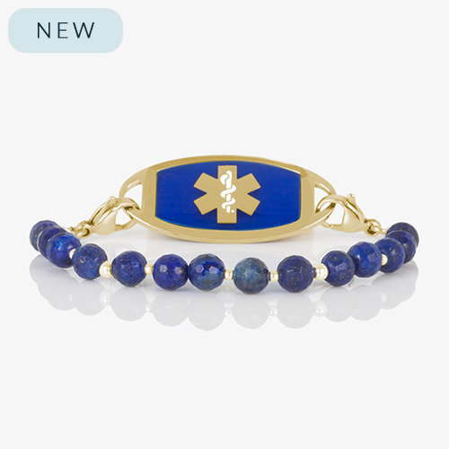 Faceted denim blue lapis beaded medical ID bracelet with gold stainless steel tag engraved with medical alert symbol.
