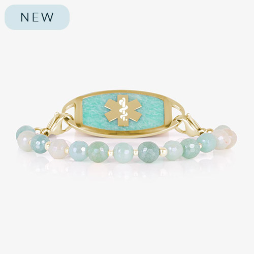 Interchangeable medical ID bracelet with aqua and cream faceted beads and gold accents, shown with a matching gold ID tag featuring a gold medical symbol on a textured amazonite inlay.
