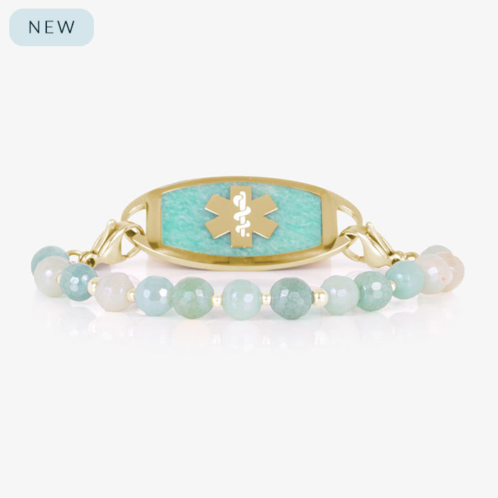 Interchangeable medical ID bracelet with aqua and cream faceted beads and gold accents, shown with a matching gold ID tag featuring a gold medical symbol on a textured amazonite inlay.