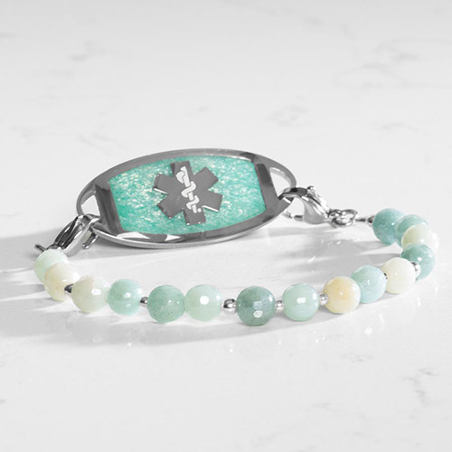 Side angle of Leah Mist bracelet in silver with polished aqua gemstone beads and a silver tag inlaid with textured amazonite background and medical alert symbol
