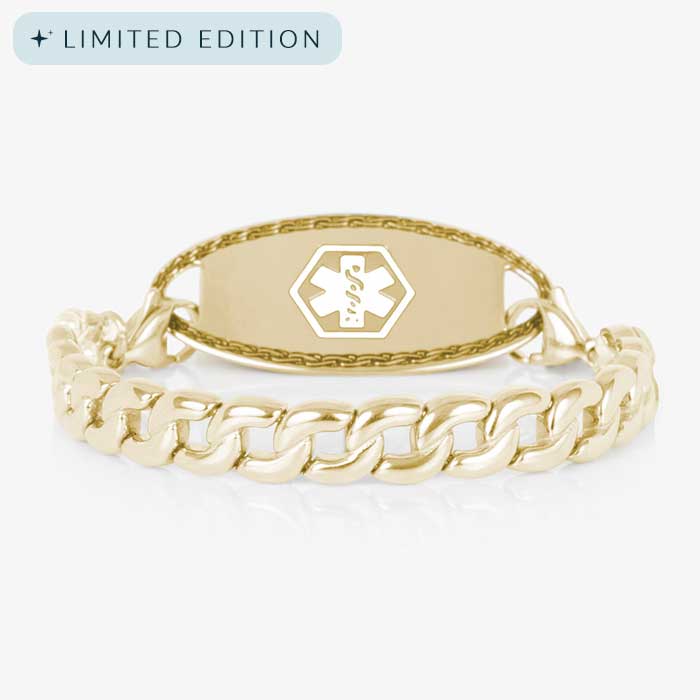 Gold medical ID bracelet for women with bold curb chain and matching gold tag engraved with a white medical symbol, shown on a clean white background.